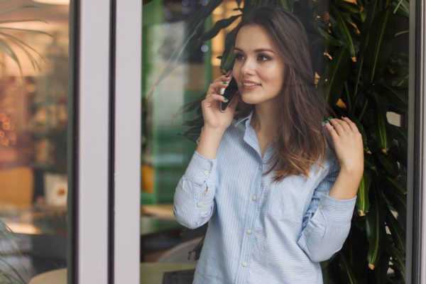 woman making a call using an Israeli Cellcom SIM card