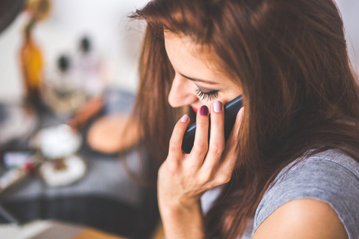 woman making a call using an Israeli Pelephone SIM card
